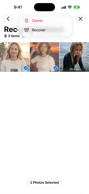 Two photos selected in Recently Deleted and the More menu open with Delete and Recover, the bottom bar reading 2 Photos Selected